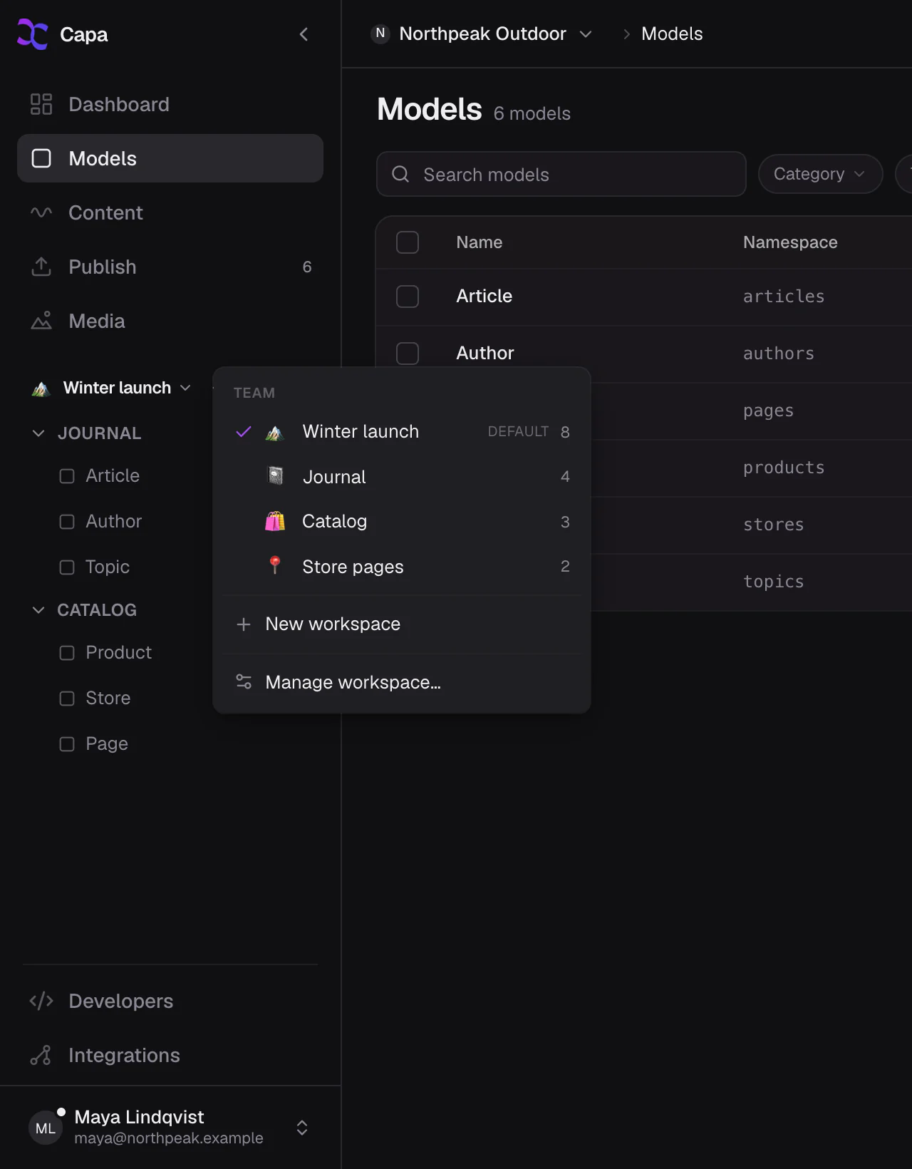 The workspace menu: switch between team workspaces, each with its own rail of models.