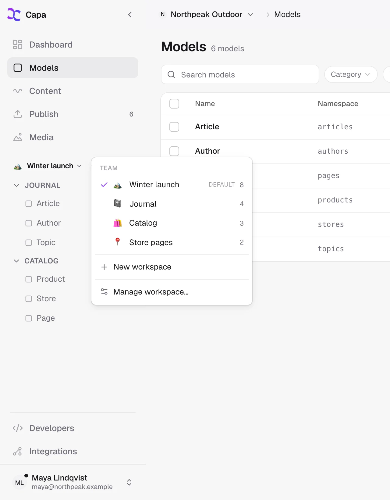 The workspace menu: switch between team workspaces, each with its own rail of models.